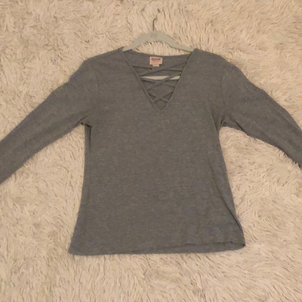 Grey long sleeve with a criss cross in the front